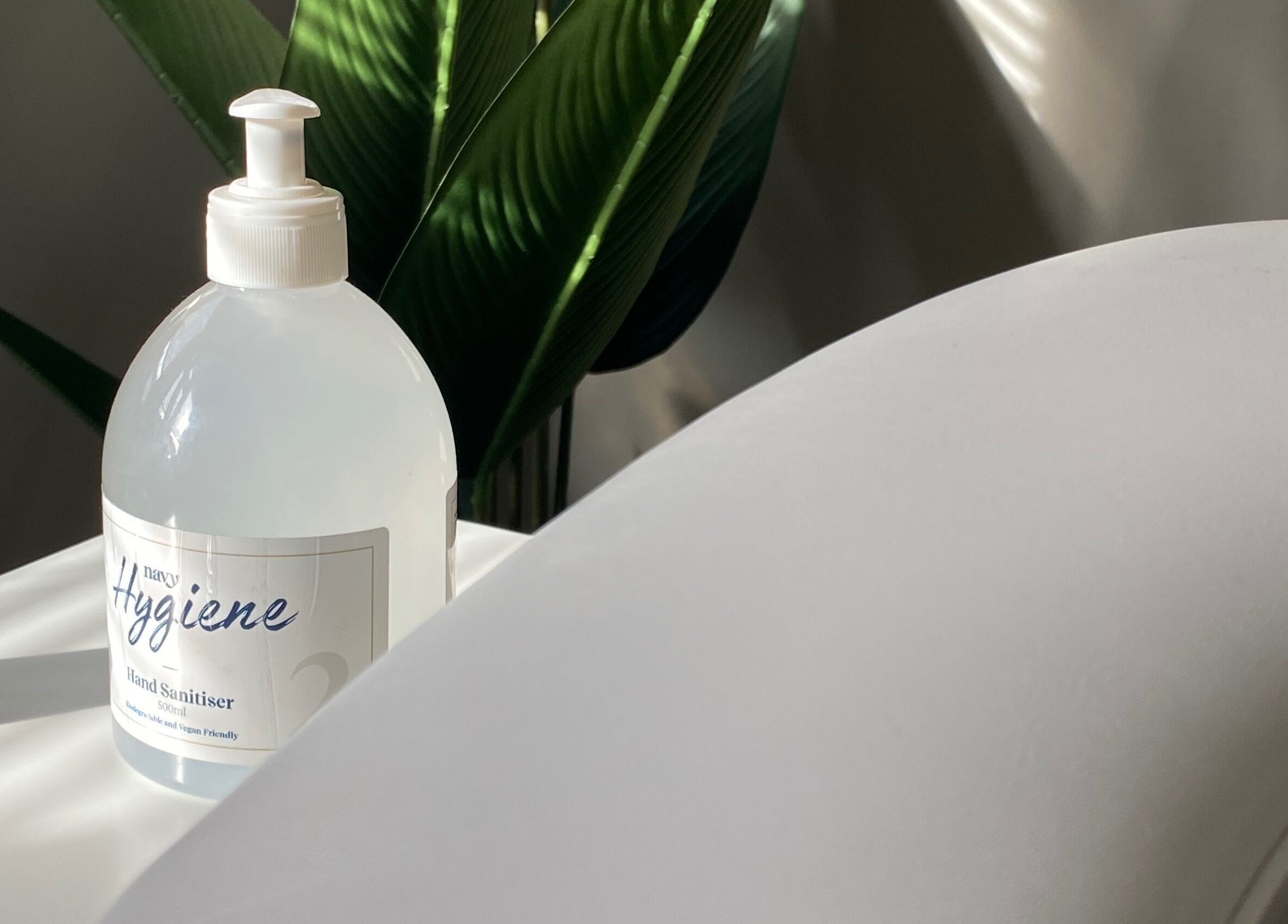 Hand sanitizer bottle on table at Beauty By Rosy in Gedling, England, GB, highlighting hygiene focus.