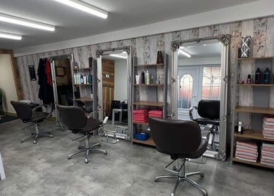 Elegant salon interior at LavenderBlue HQ in Herne Bay, England, GB with stylish chairs and mirrors.