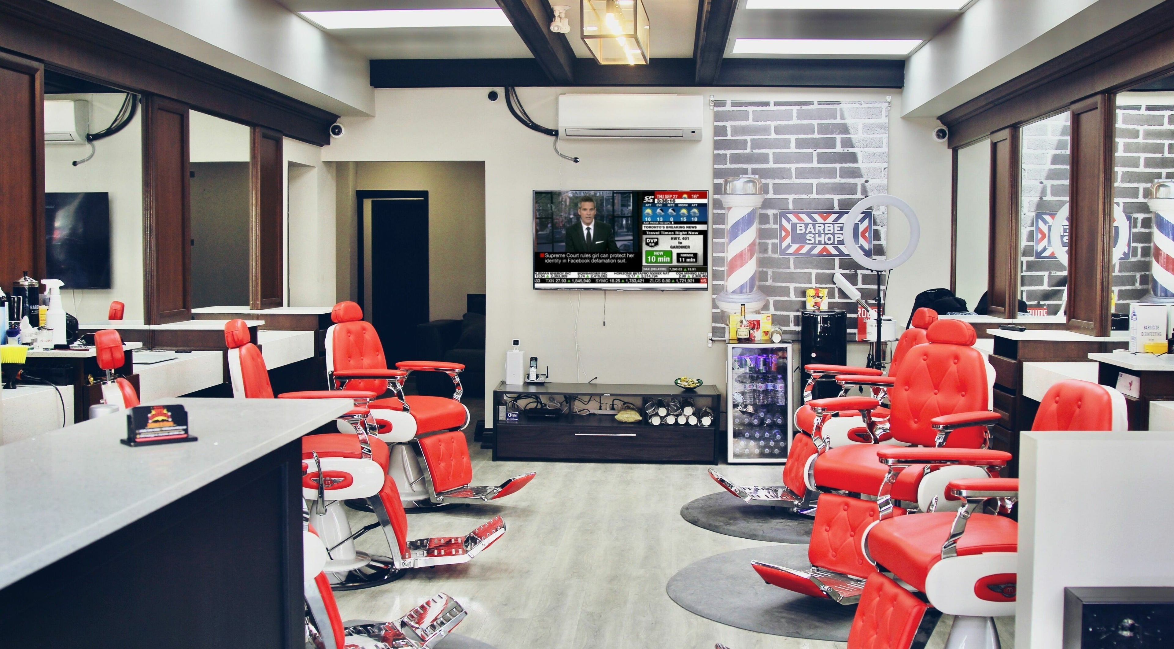 Modern interior of GT8 Barbershop with red chairs in Toronto, Ontario, CA.