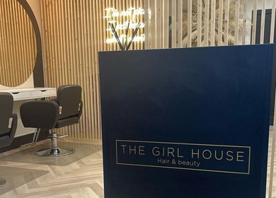 Elegant salon interior at Hairbytamarakelly in Leeds, England, GB featuring stylish chairs and modern decor.