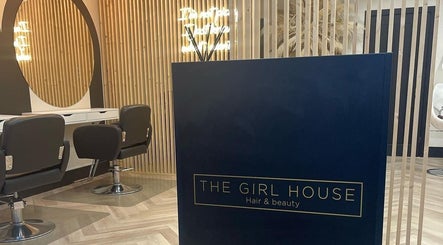 Elegant salon interior at Hairbytamarakelly in Leeds, England, GB featuring stylish chairs and modern decor.