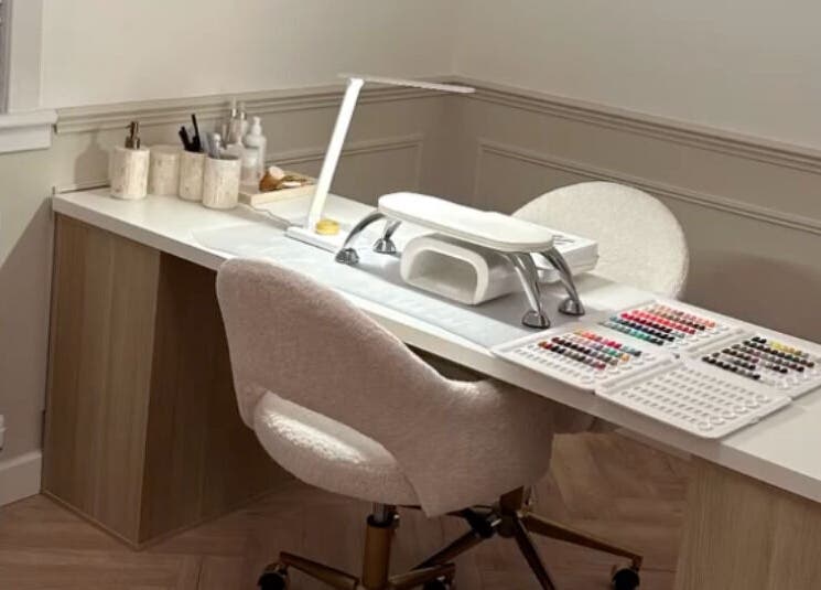 Nail station at Nimmos Nails and Beauty, Whitburn, Scotland, GB featuring organized tools and nail polishes.