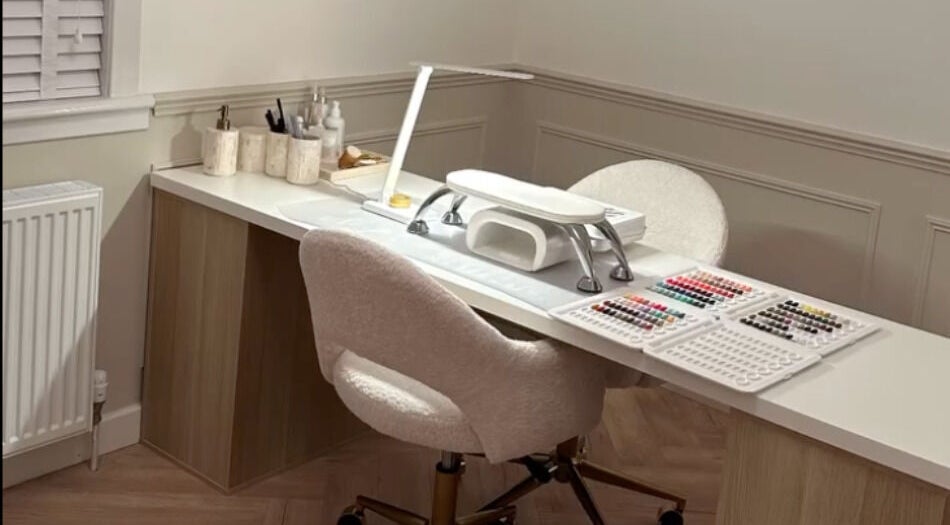 Nail station at Nimmos Nails and Beauty, Whitburn, Scotland, GB featuring organized tools and nail polishes.