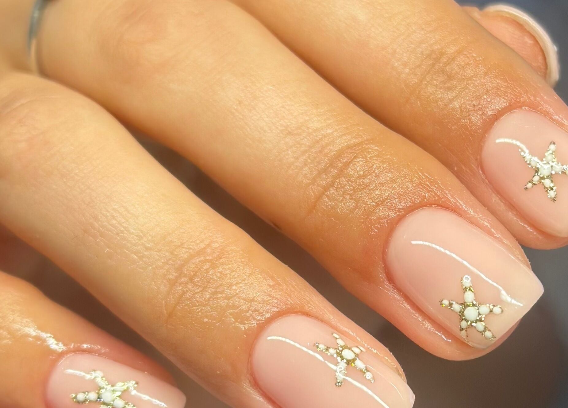 Elegant nail art with star designs at Nimmos Nails and Beauty, Whitburn, Scotland, GB.