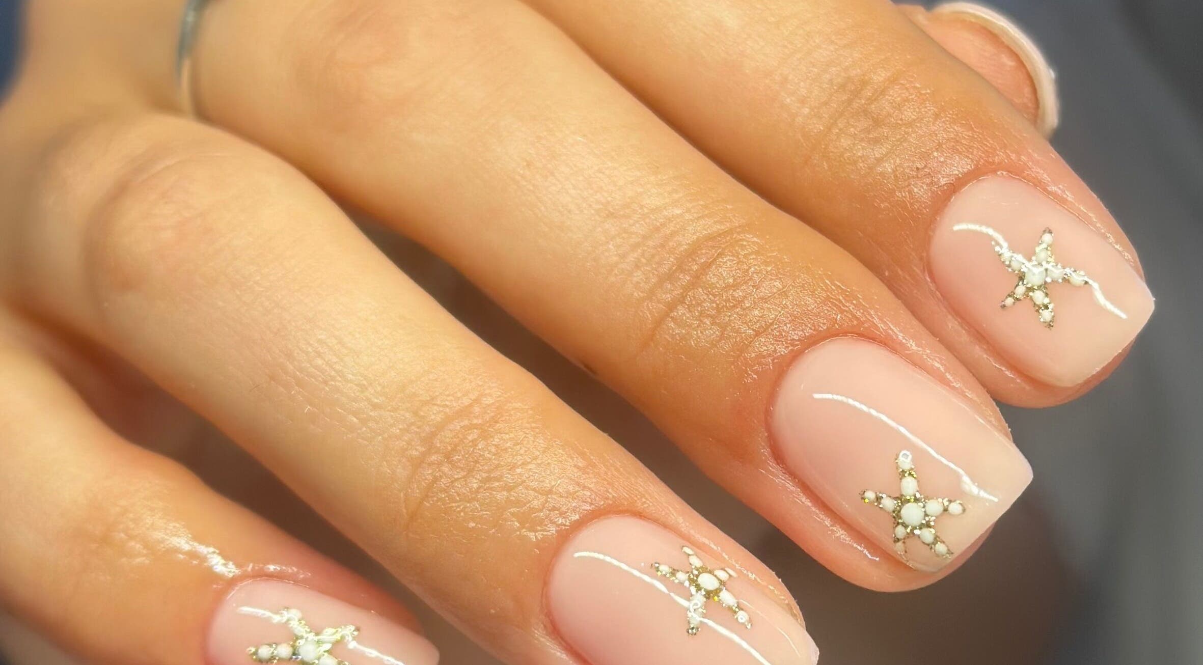 Elegant nail art with star designs at Nimmos Nails and Beauty, Whitburn, Scotland, GB.