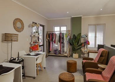 Stylish interior of Permalicious Ink, Beauty and Aesthetics in Sandton, Gauteng, ZA with cozy seating and decor.