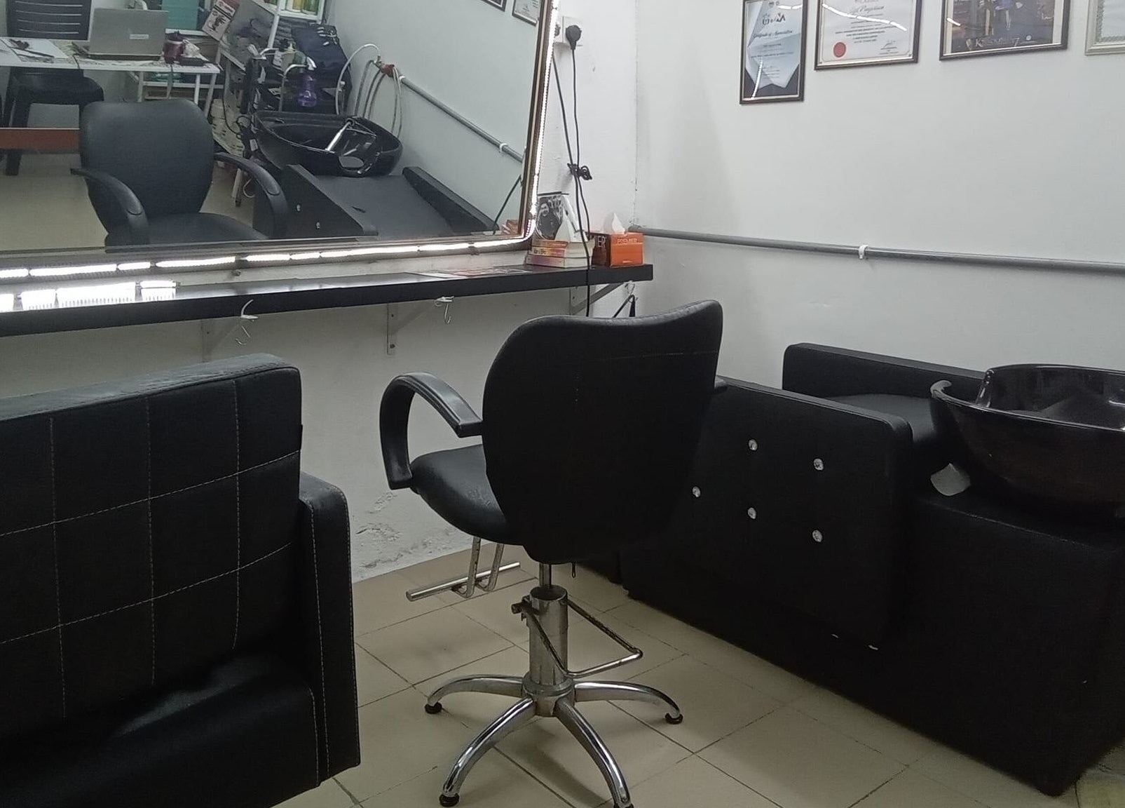 Hair styling station at Aora Spa and Wellness Kuala Langat, Telok Panglima Garang, Selangor, MY, showcasing chairs and sink.