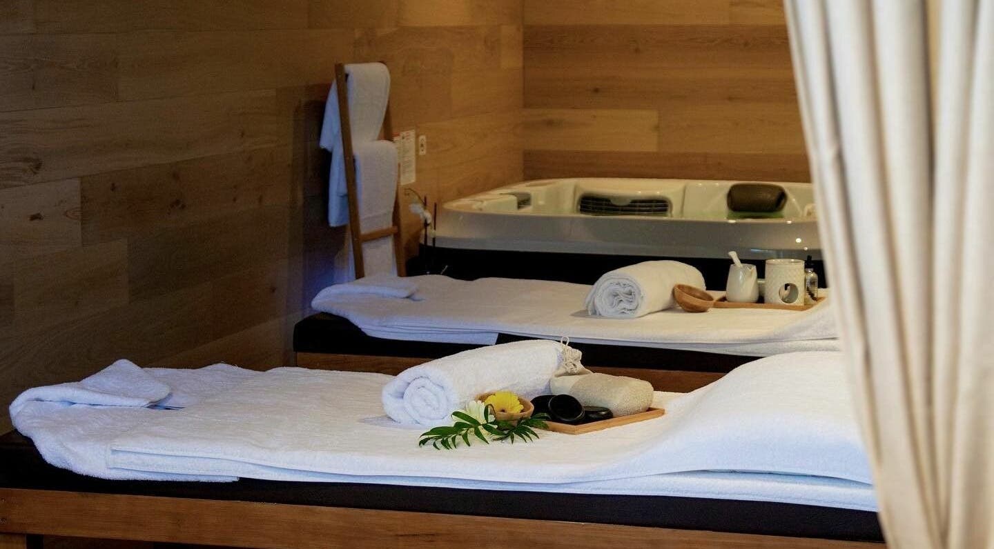 Relaxing spa room at La Terre Day Spa in Bruce, Australian Capital Territory, AU with a massage table and towels.