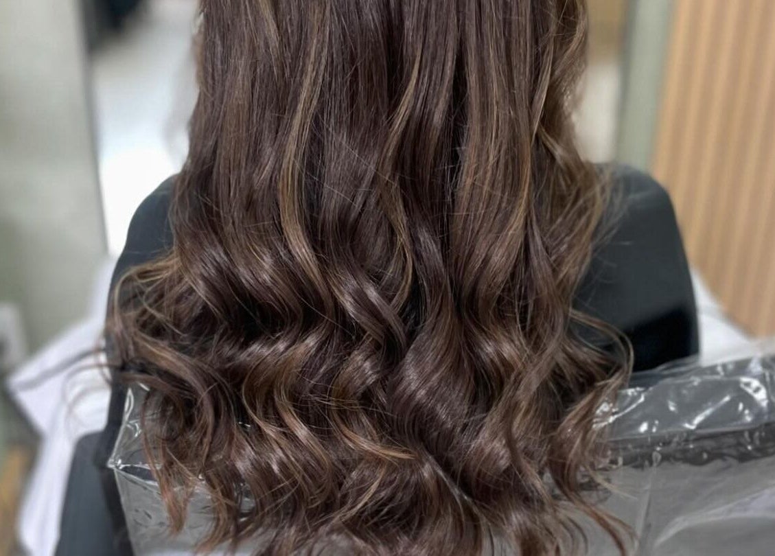 Flowing brunette hair styled with soft waves at Image Reflections, Johannesburg, Gauteng, ZA.