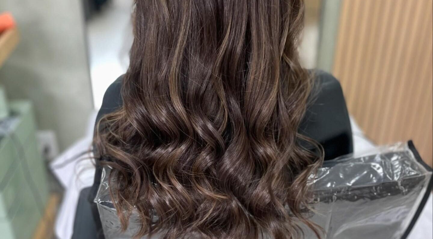 Flowing brunette hair styled with soft waves at Image Reflections, Johannesburg, Gauteng, ZA.