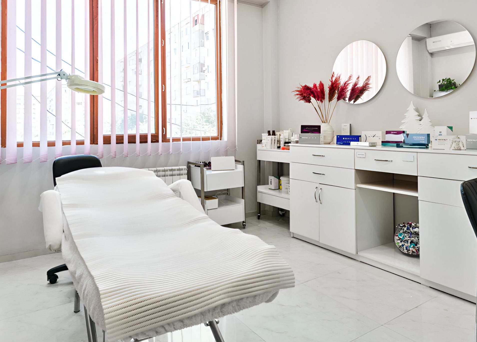 Tranquil treatment room at MG esthetica Madagoni in Rustavi, Kvemo Kartli, GE with spa bed and elegant decor.