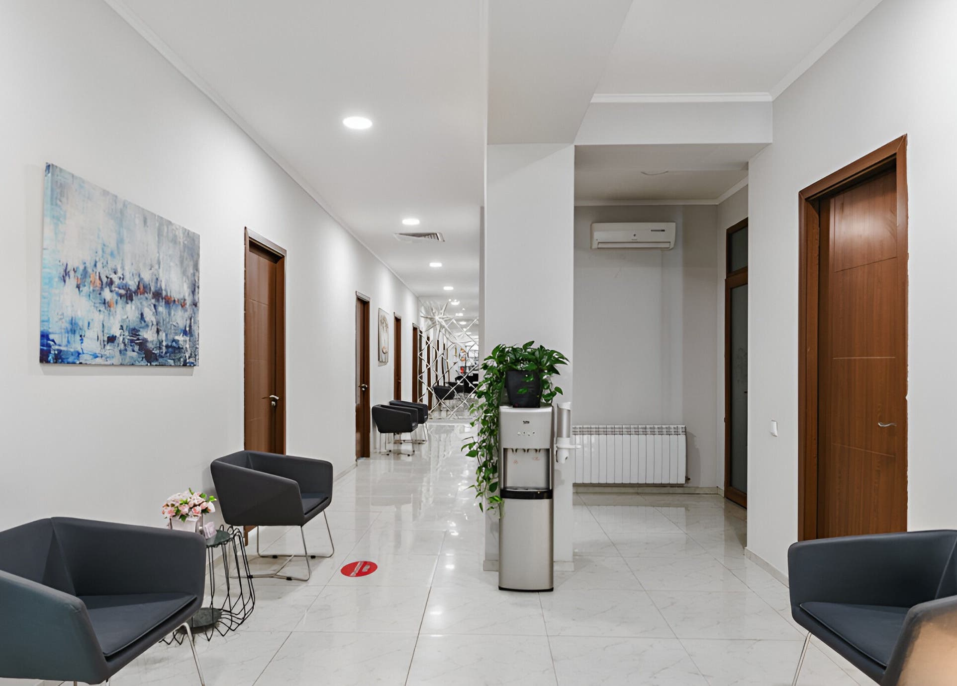 Spacious corridor at MG esthetica Madagoni, Rustavi, Kvemo Kartli, GE with modern seating and decor.