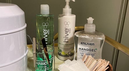 Beauty products and tools at Billie’s Brows and Nails, Hastings, England, GB, showcasing wax and sanitizer.