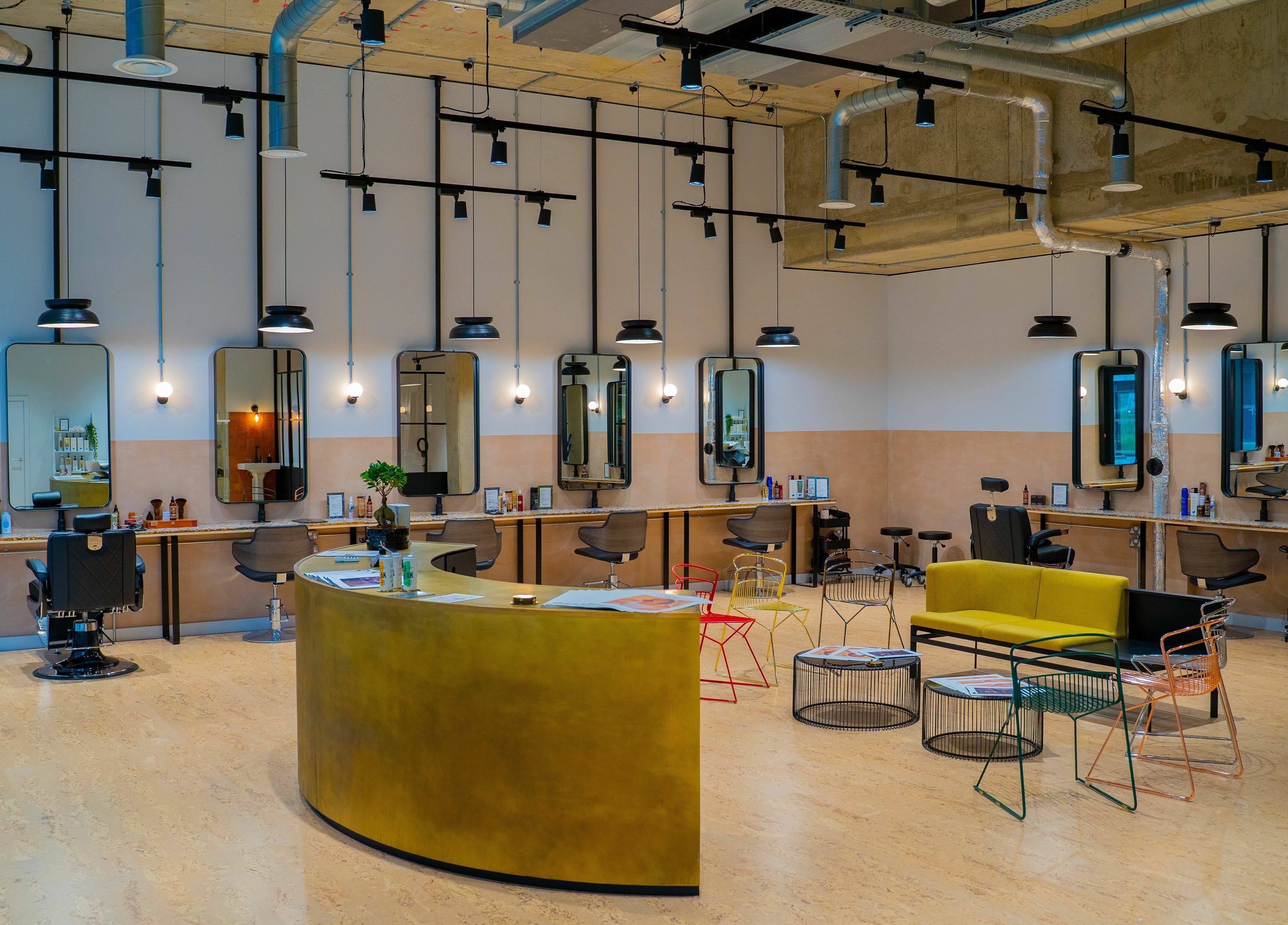 Modern salon interior at Chop Chop London Wembley Park, Park, London, England, GB with stylish workstations.