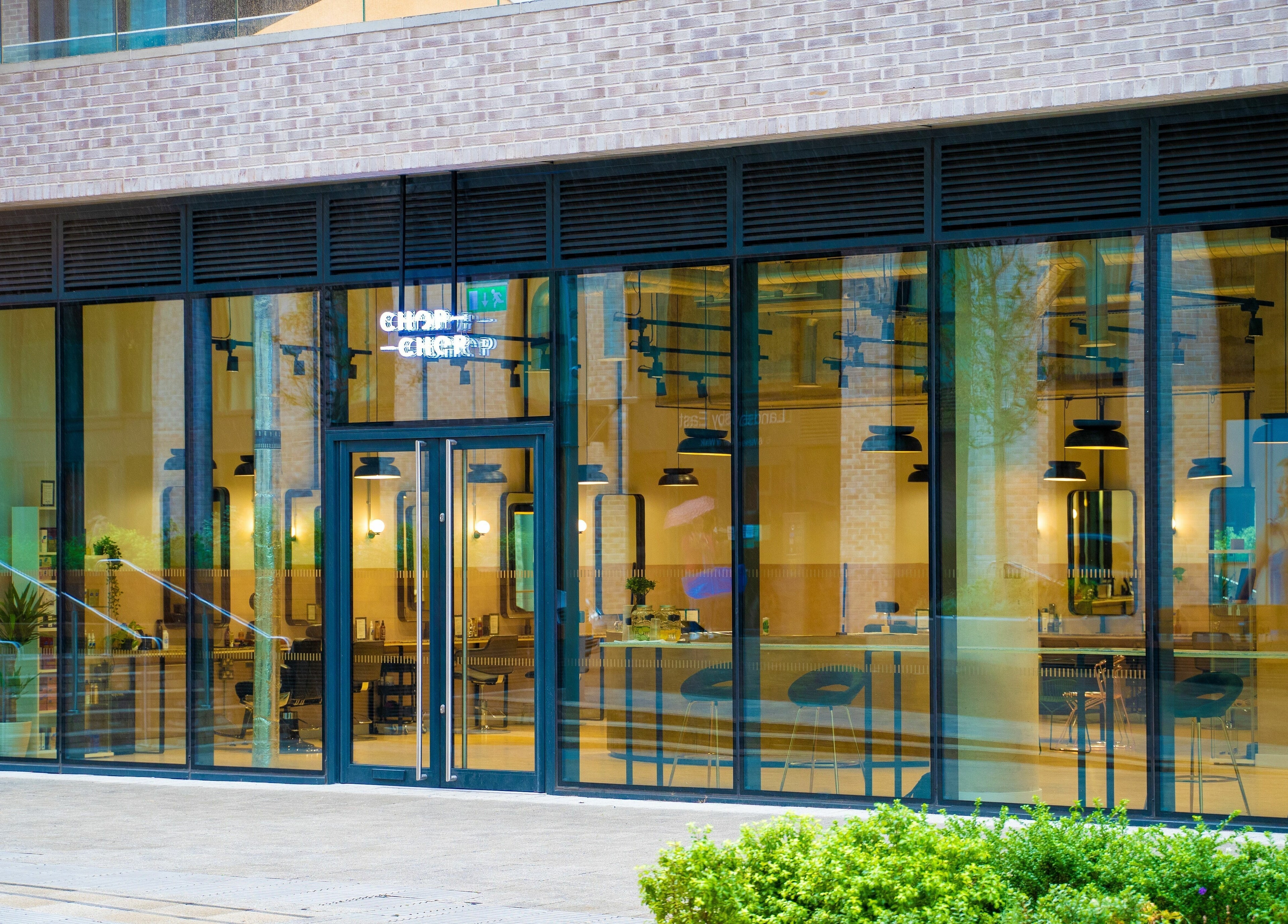 Front view of Chop Chop London Wembley Park at Park, London, England, GB with glass windows and modern design.