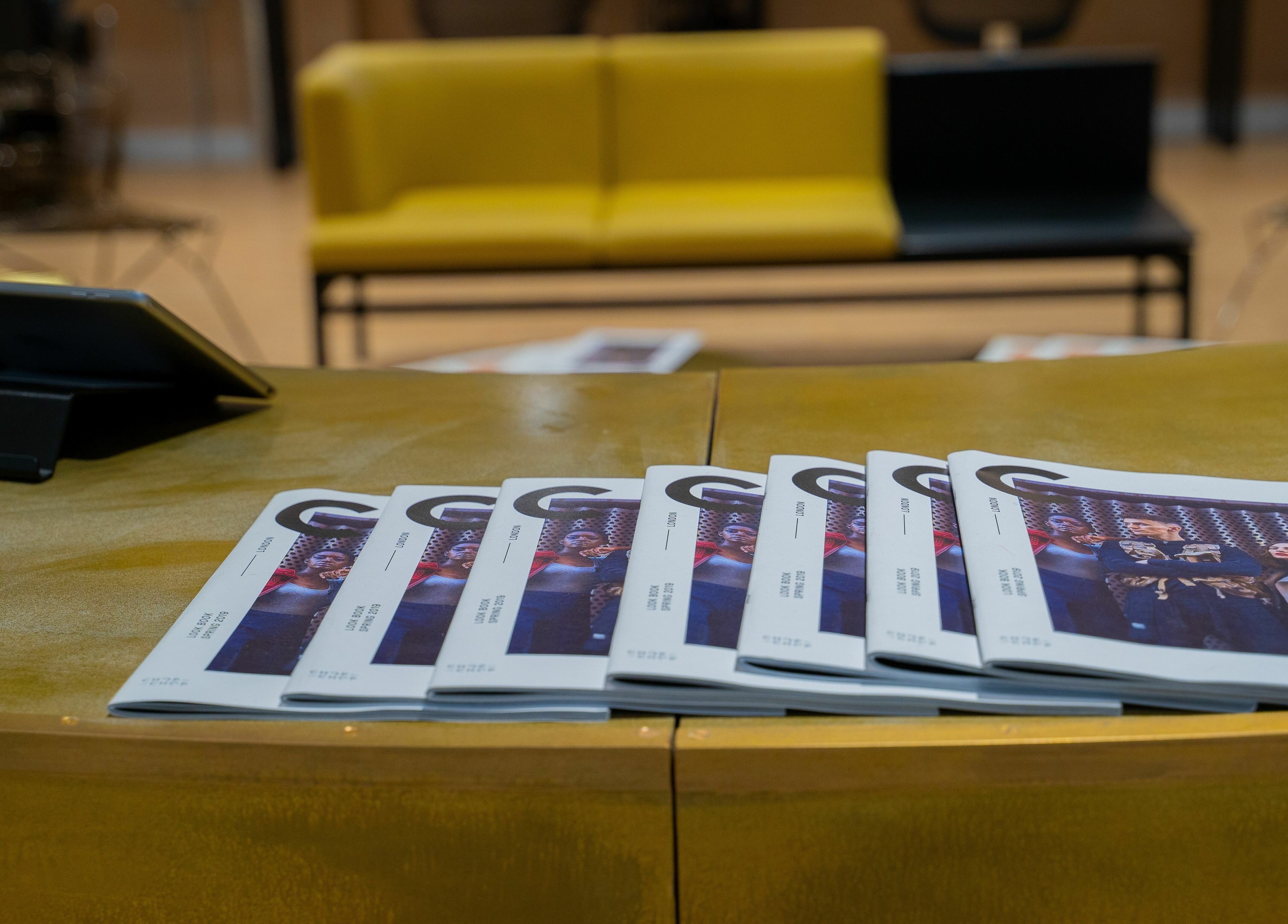 Magazines on a chic reception desk at Chop Chop London Wembley Park, Park, London, England, GB.