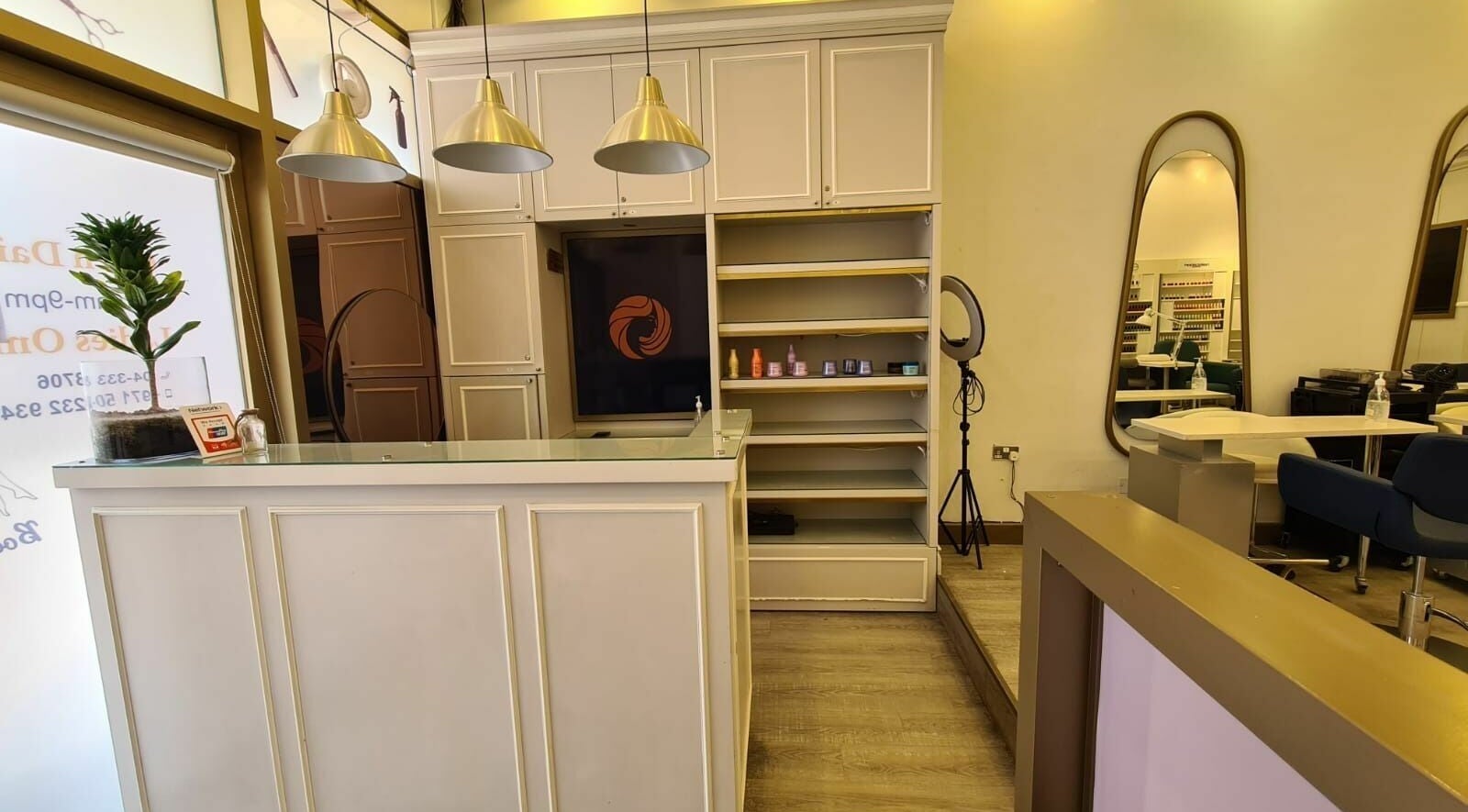 Sophisticated reception area at Front Row Salon, Dubai, AE, with modern decor and ambient lighting.