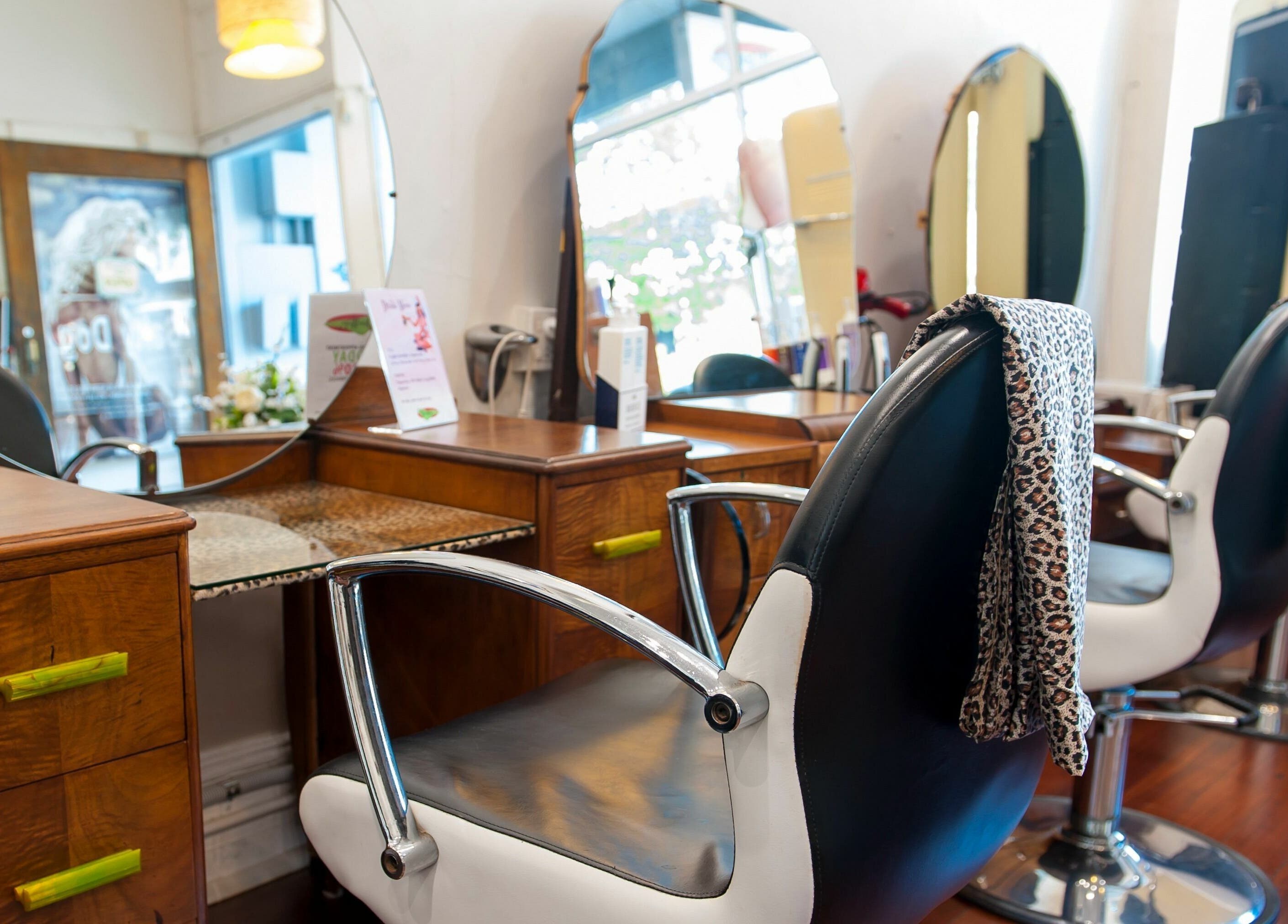 Stylish salon stations at Doowop Hair in Fremantle, Western Australia, AU with modern decor and large mirrors.