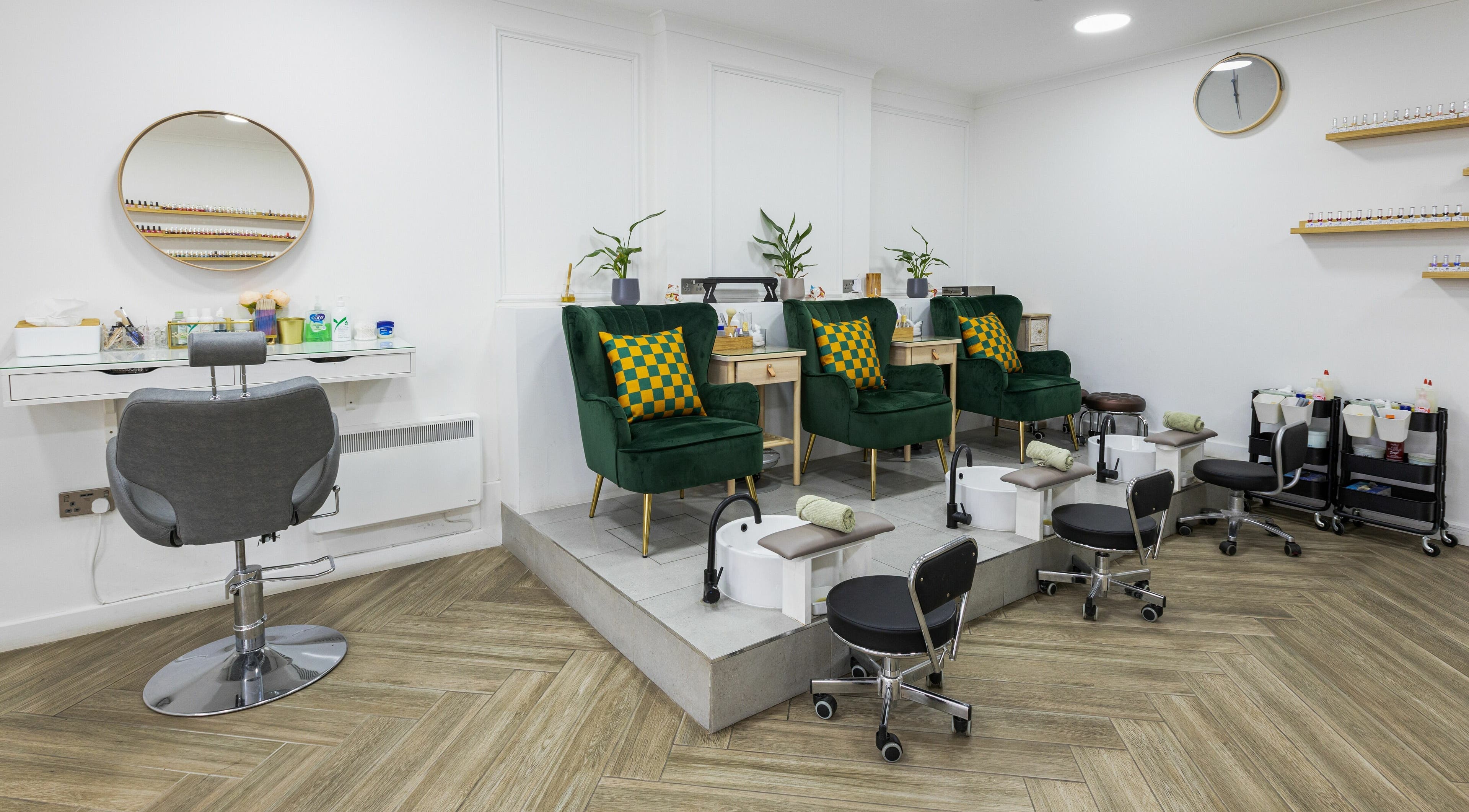 Elegant and cozy nail salon at Nail Dress, London, England, GB showcasing plush chairs and modern decor.