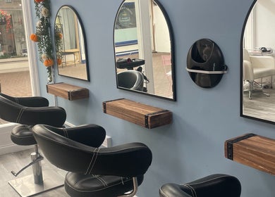 Cozy seating and mirrors at Hive Hair Lounge, Saint Helier, St Helier, JE.
