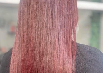 Smooth, vibrant red hair styled at Hive Hair Lounge, Saint Helier, St Helier, JE.
