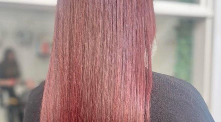 Smooth, vibrant red hair styled at Hive Hair Lounge, Saint Helier, St Helier, JE.