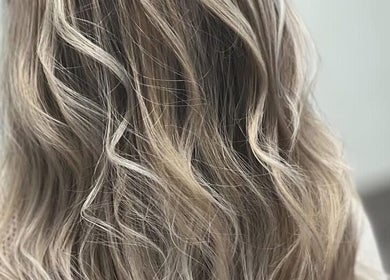 Soft, wavy blonde highlights expertly styled at Hive Hair Lounge, Saint Helier, St Helier, JE.