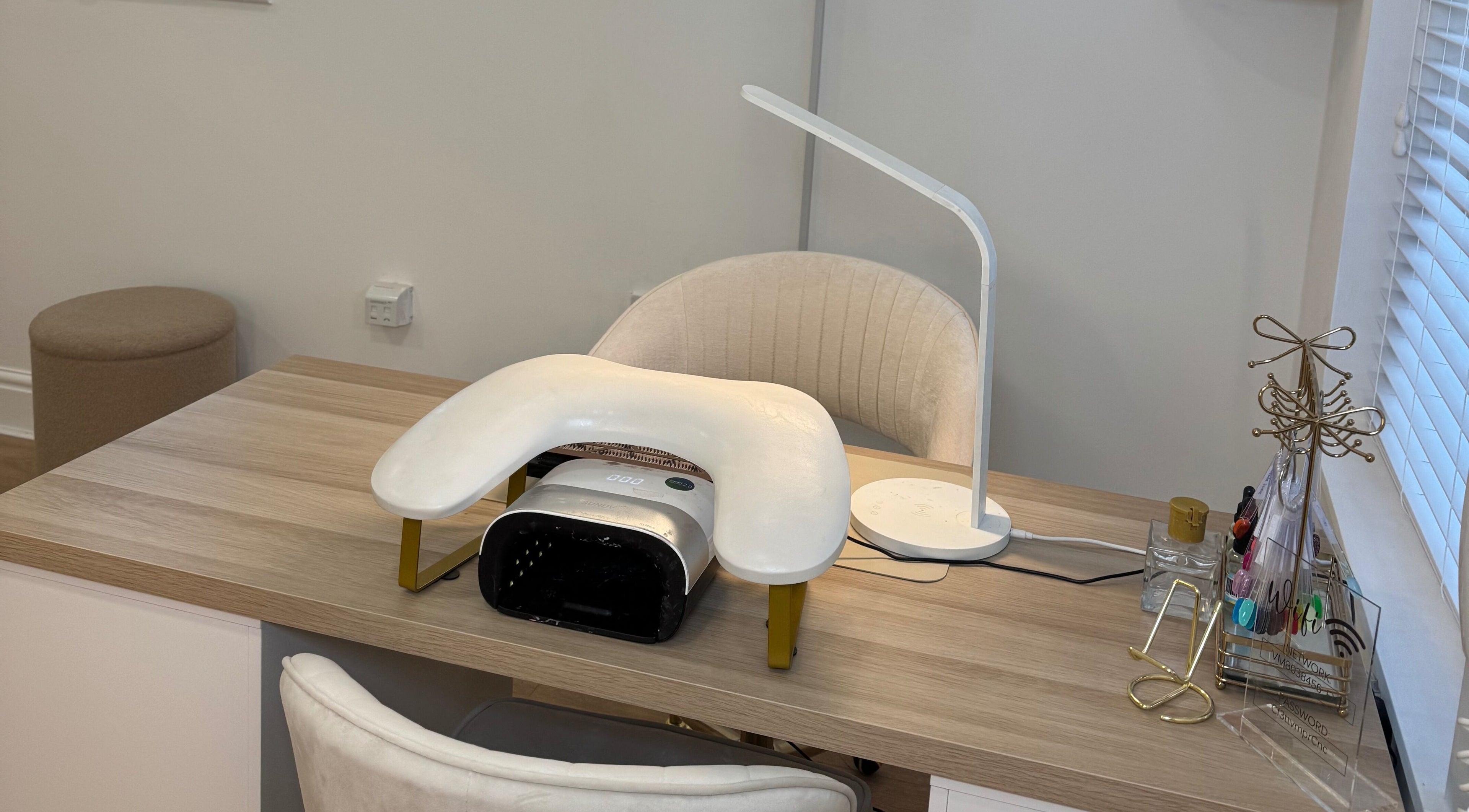 Modern nail station at Glam by Beth, Bolton, England, GB, featuring a stylish lamp and manicure tools.