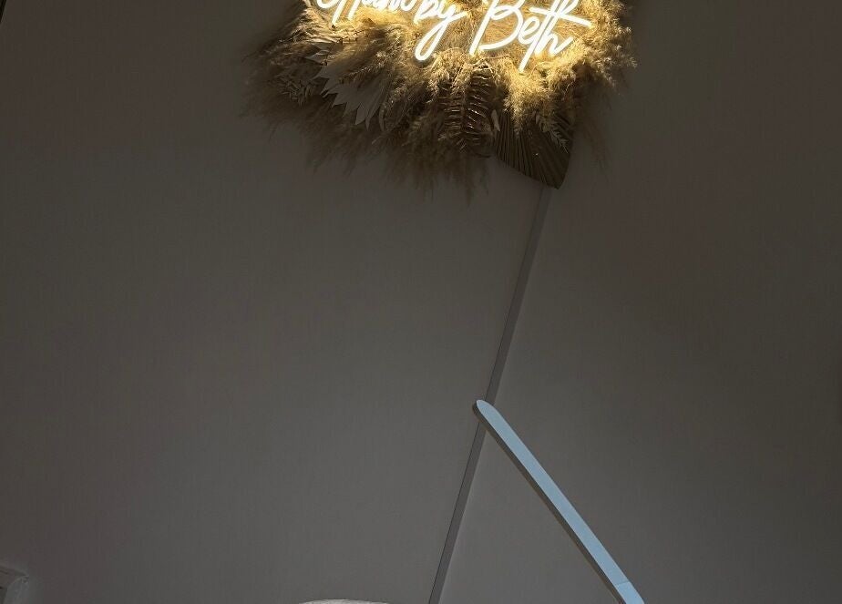 Neon sign at Glam by Beth, Bolton, England, GB, with elegant decor epitomizing relaxation.