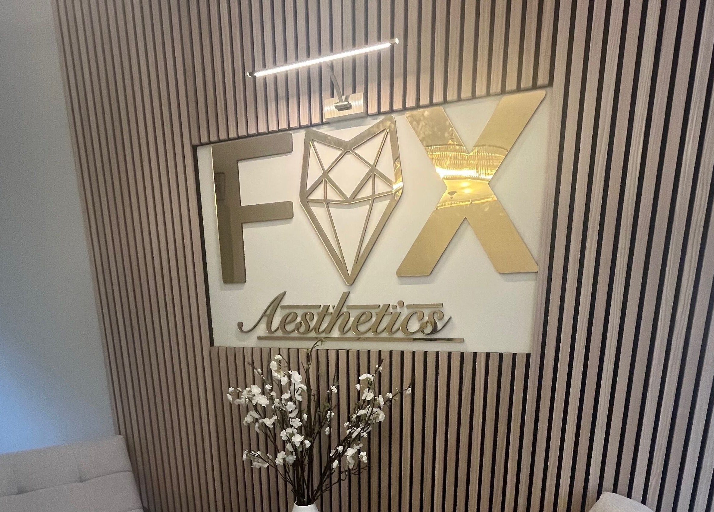 Fox Aesthetics sign and decor in elegant setting, Bridgend, Wales, GB