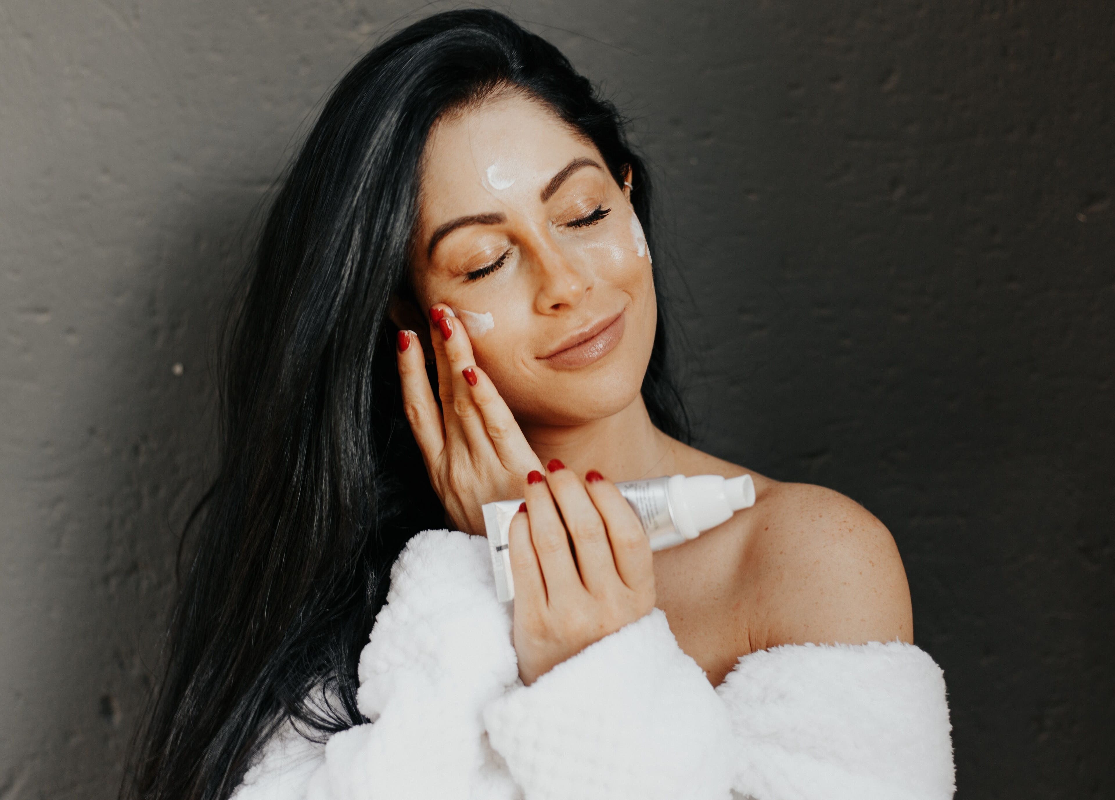 Woman enjoying skincare routine at Glow Studio, Sandton, Gauteng, ZA for a radiant glow.