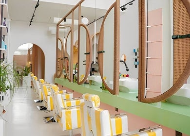 Modern salon interior at La Palma Beauty House in الرياض, منطقة الرياض, SA, featuring stylish chairs and mirrors.