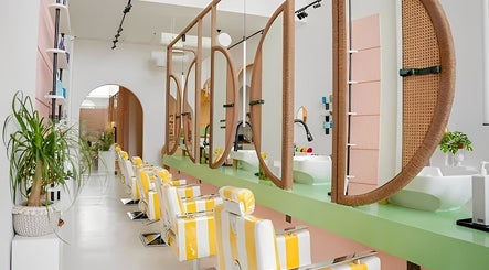 Modern salon interior at La Palma Beauty House in الرياض, منطقة الرياض, SA, featuring stylish chairs and mirrors.