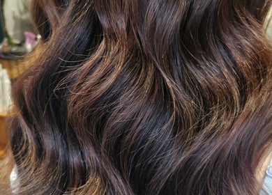 Styled brown hair with glossy waves at All About You, Armadale, Scotland, GB.