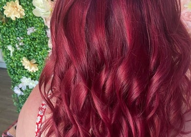 Gorgeous crimson hair waves at All About You salon in Armadale, Scotland, GB, showcasing vibrant coloring.