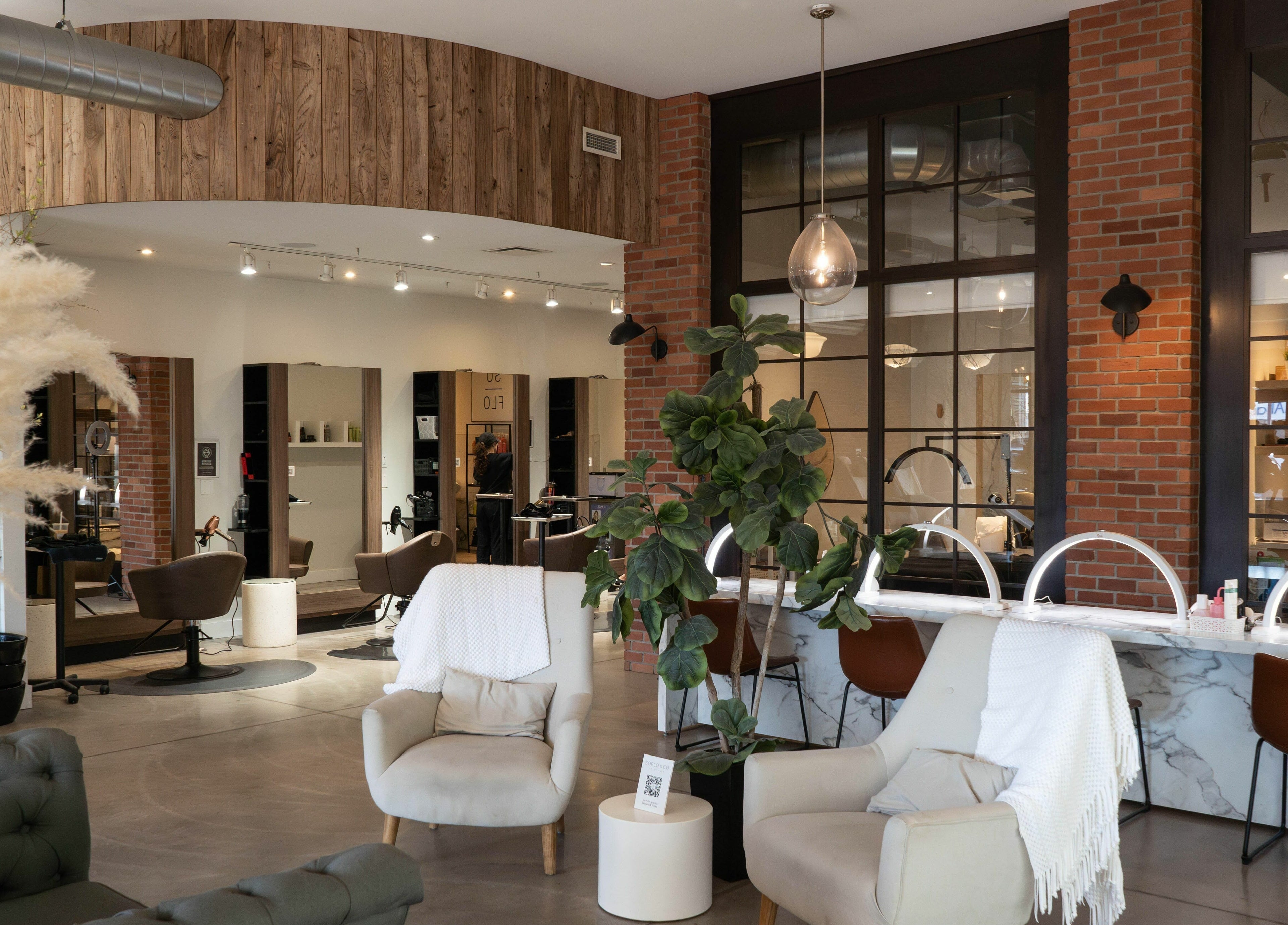 Elegant interior of SoFlo & Co North in Moncton, New Brunswick, CA showcasing a cozy seating area.