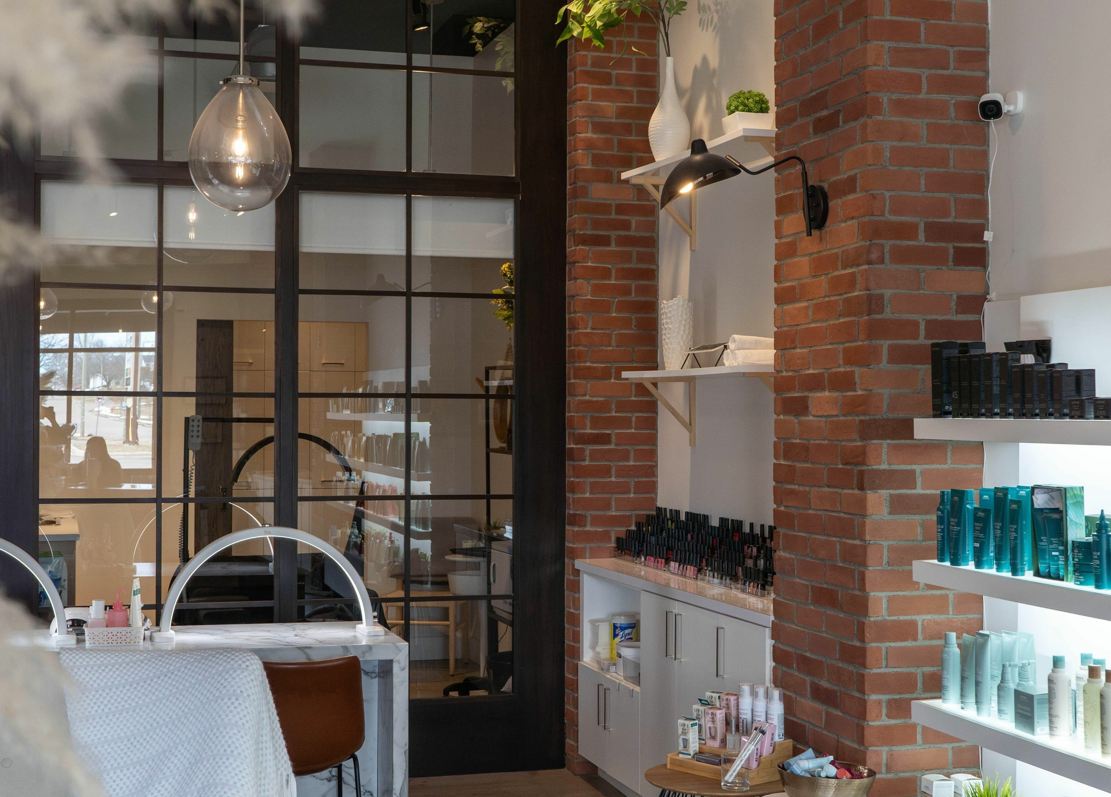 Inside SoFlo & Co North, Moncton, New Brunswick, CA, featuring a chic spa interior with products on display.