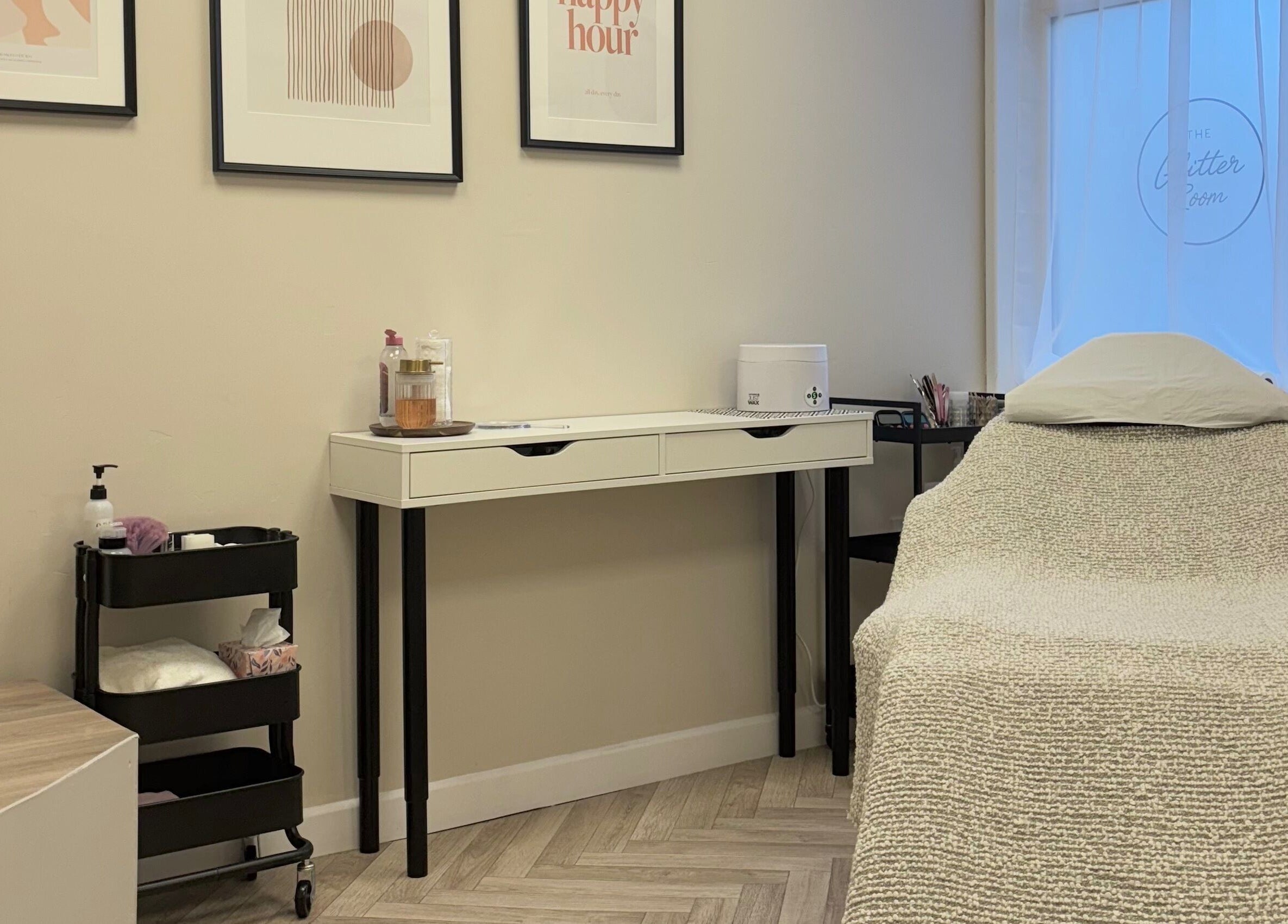 Cozy treatment room at The Glitter Room, Cannock, England, GB with inviting decor and massage table.