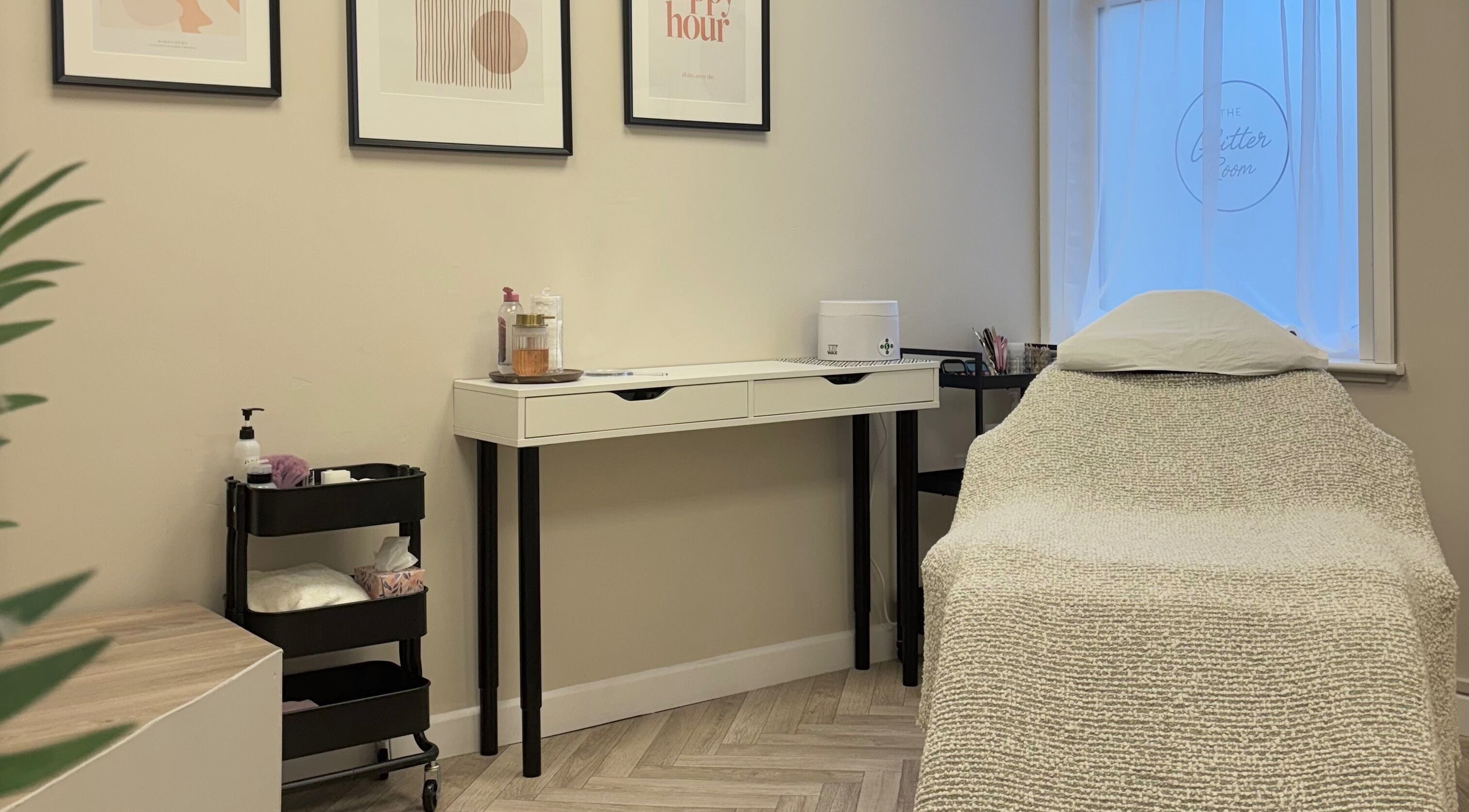 Cozy treatment room at The Glitter Room, Cannock, England, GB with inviting decor and massage table.
