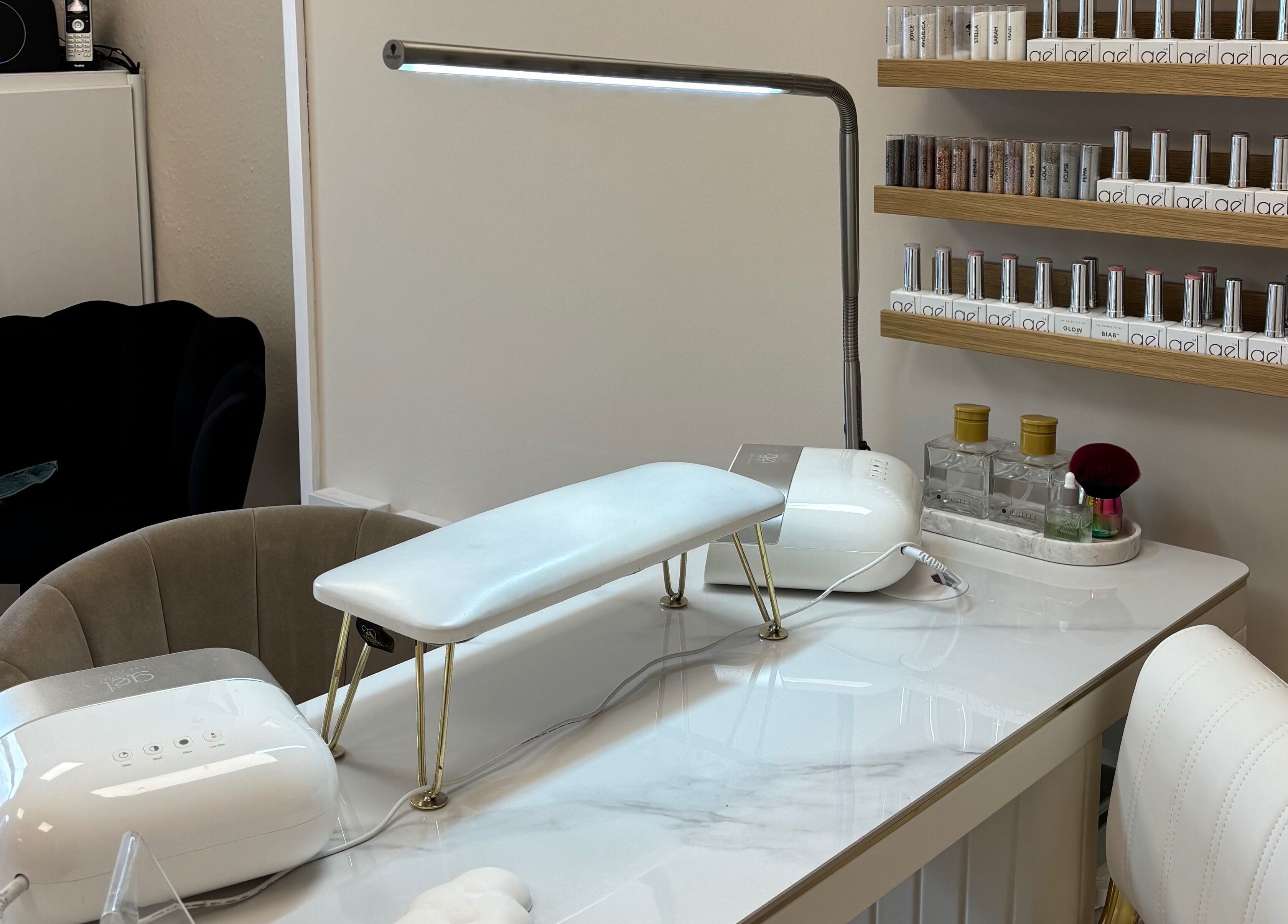 Bright nail station at The Glitter Room, Cannock, England, GB, featuring nail polish and modern equipment.