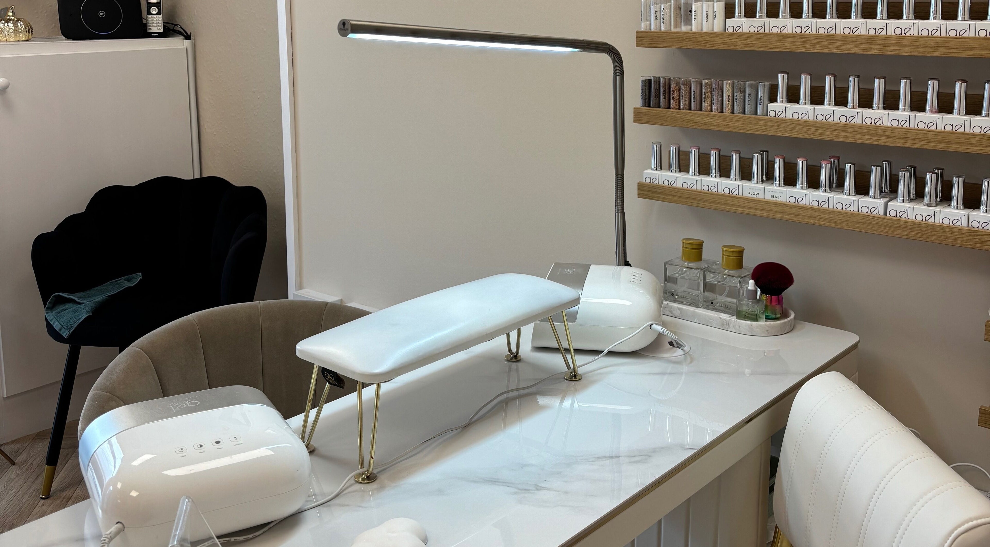 Bright nail station at The Glitter Room, Cannock, England, GB, featuring nail polish and modern equipment.