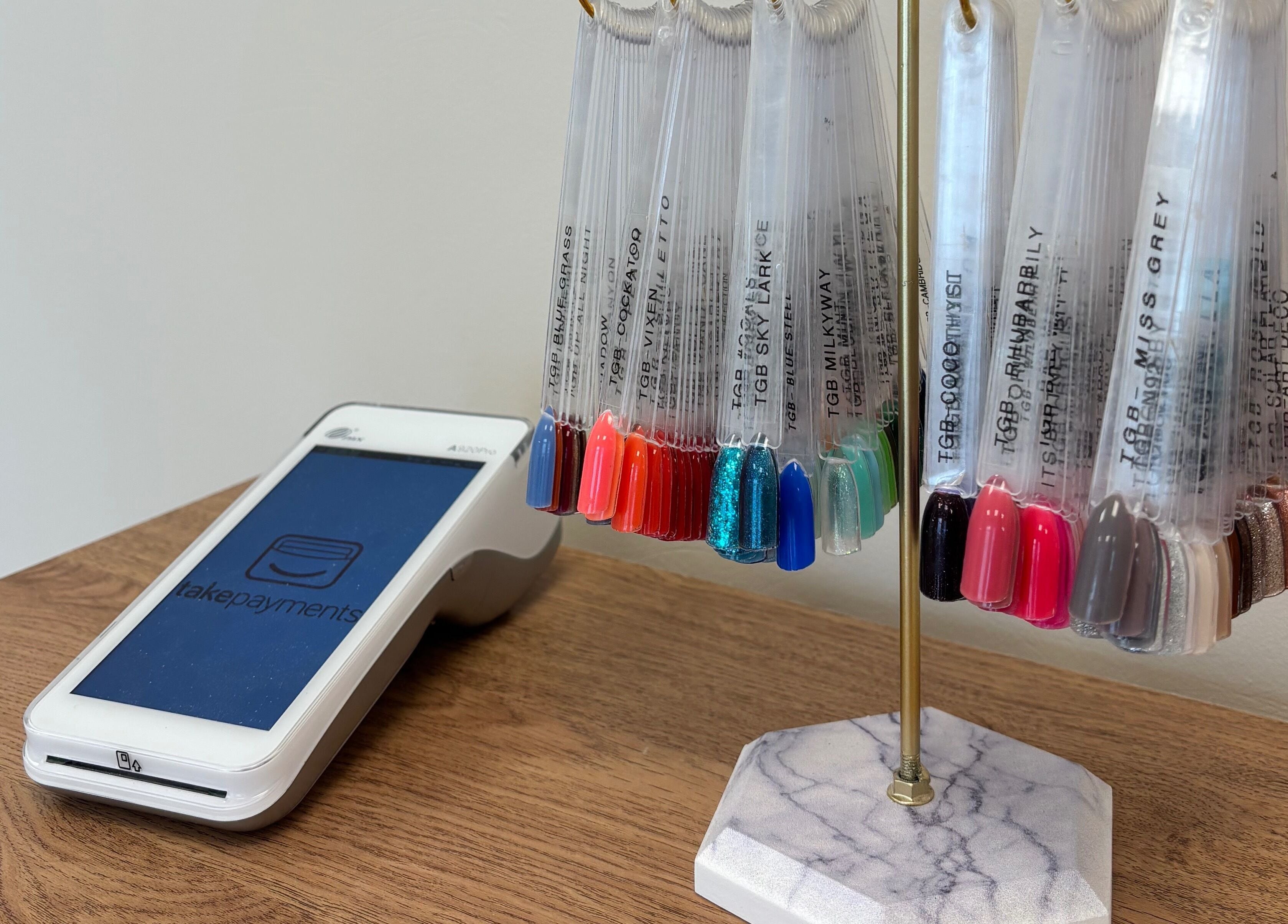 Nail polish samples and payment terminal at The Glitter Room, Cannock, England, GB.