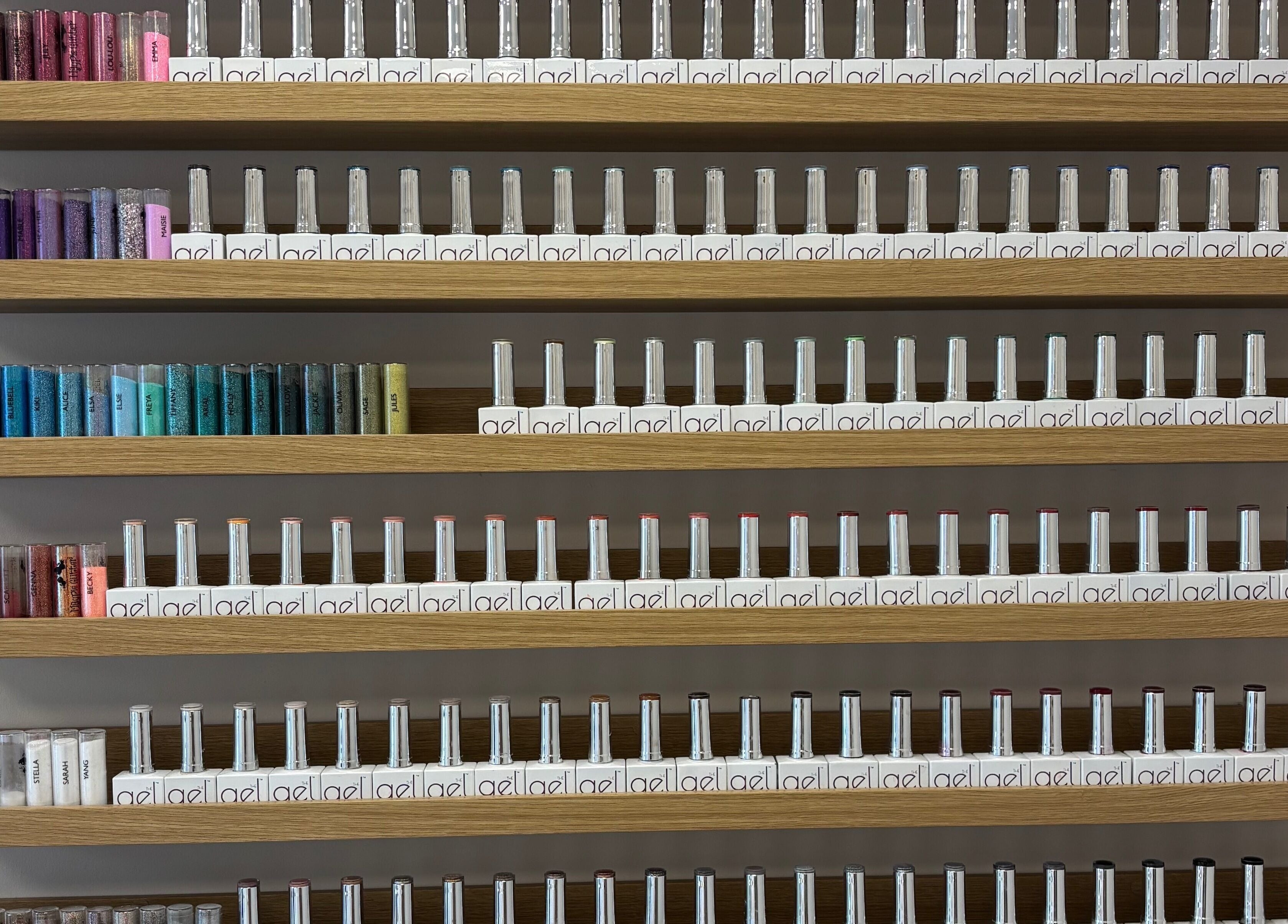 Vibrant nail polish display at The Glitter Room, Cannock, England, GB showcasing diverse colors.