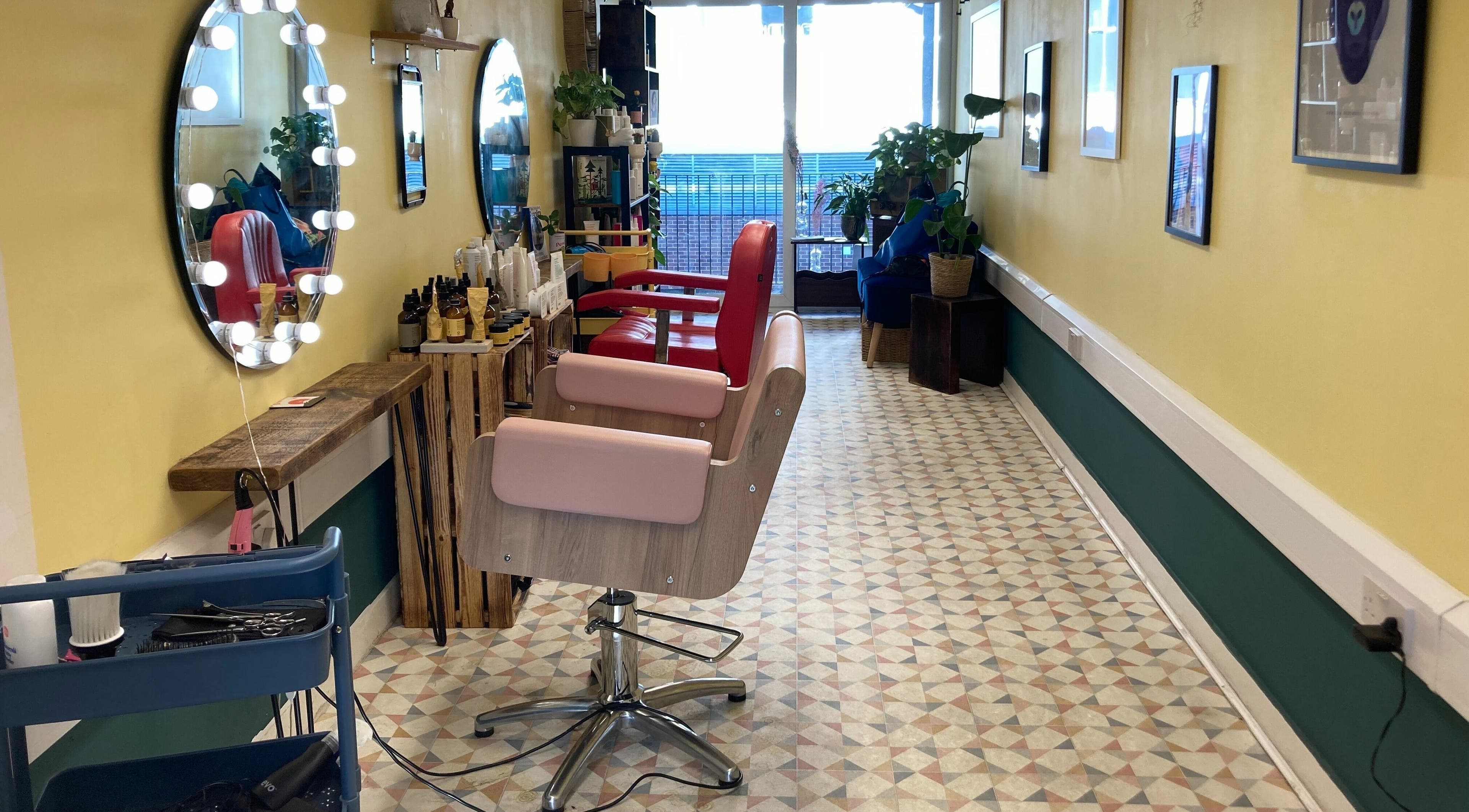 Interior of Salotto with stylish mirrors and chairs, London, England, GB.