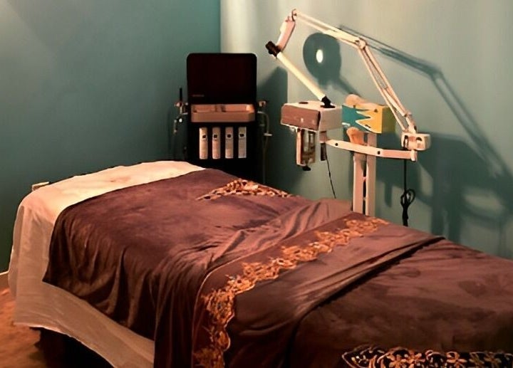 Relaxing treatment room at Acqua spa, Orlando, Florida, US with a massage bed and soothing decor.