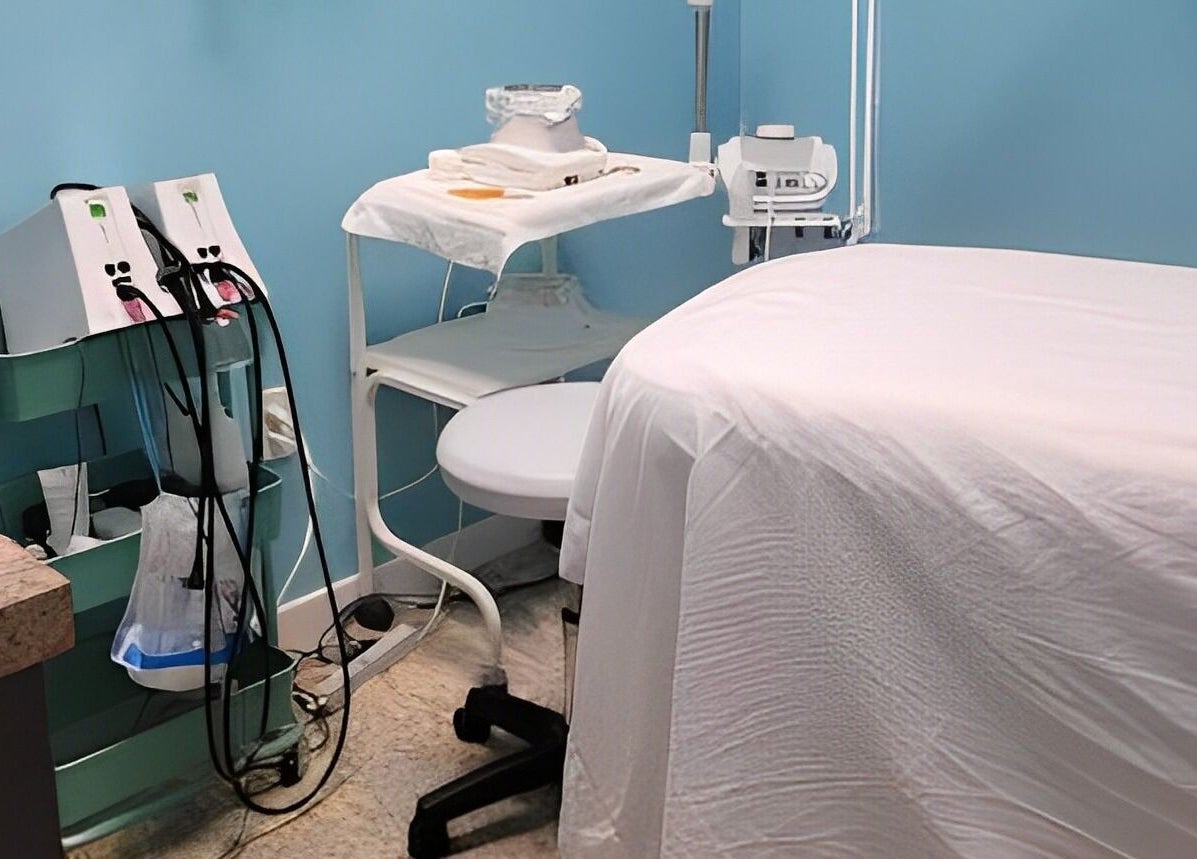 Acqua spa's tranquil treatment room in Orlando, Florida, US, featuring advanced wellness equipment and a massage table.