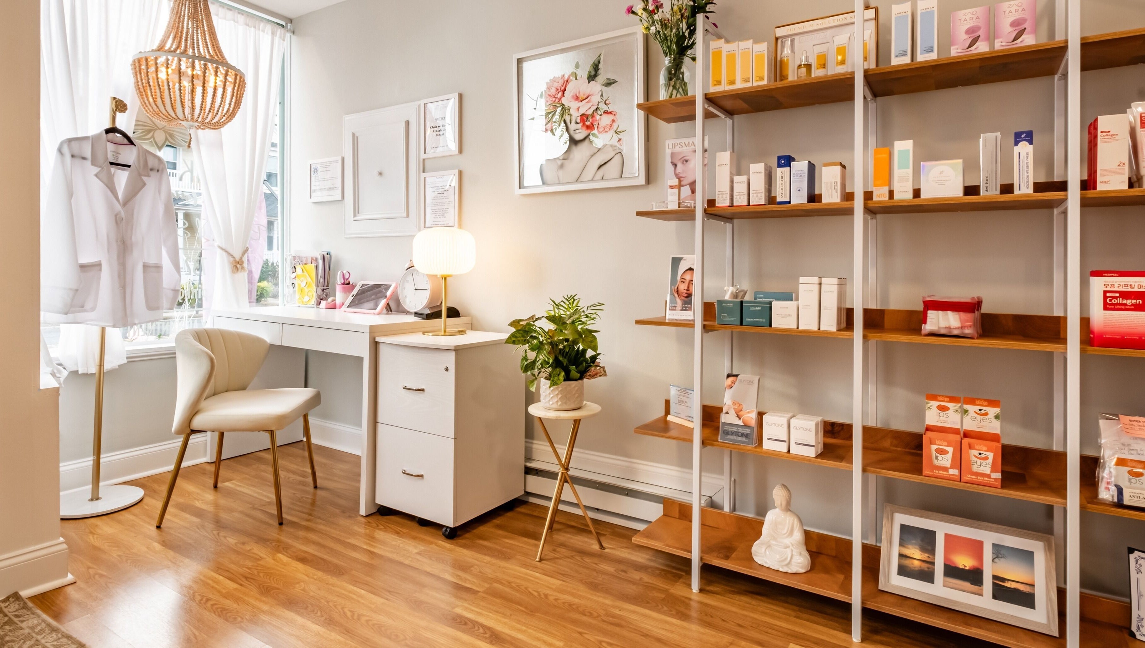 Chic interior of Pink Glow Facial Room in Manasquan, New Jersey, US featuring a cozy chair and product shelves.