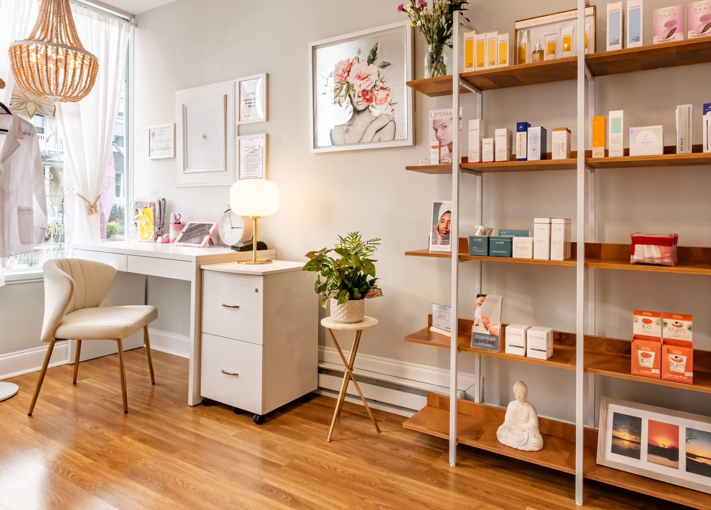 Chic interior of Pink Glow Facial Room in Manasquan, New Jersey, US featuring a cozy chair and product shelves.