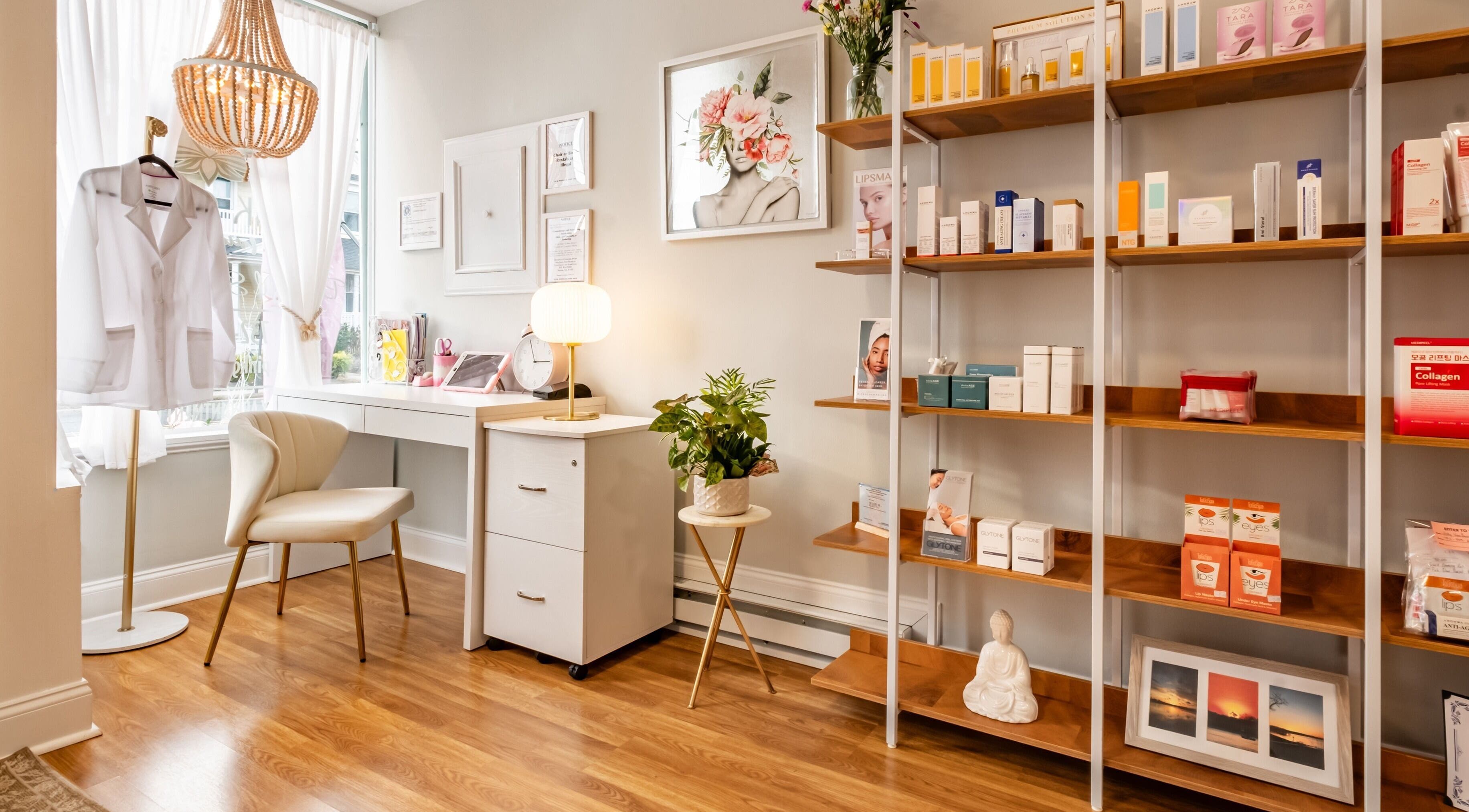 Chic interior of Pink Glow Facial Room in Manasquan, New Jersey, US featuring a cozy chair and product shelves.