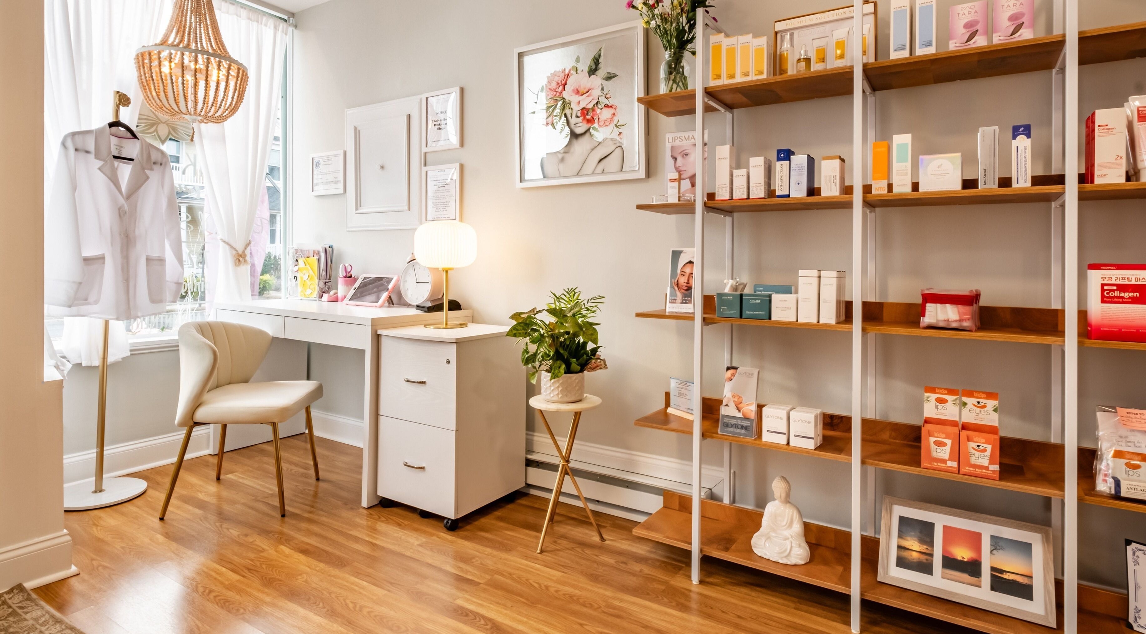 Chic interior of Pink Glow Facial Room in Manasquan, New Jersey, US featuring a cozy chair and product shelves.